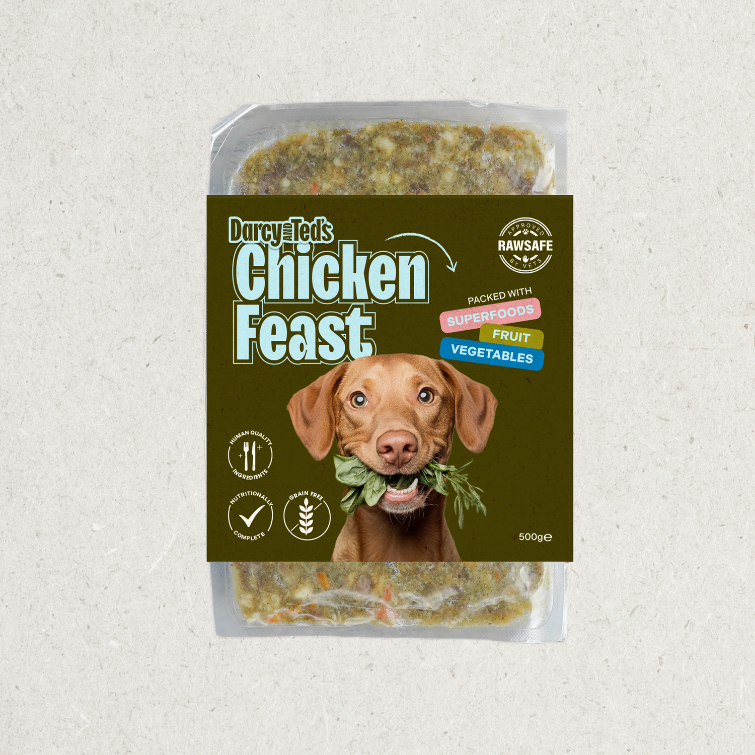 Dog food package labeled 'Chicken Feast' with a dog holding a leaf on a textured gray background