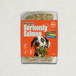 Darcy and Teds Seriously Salmon meal package with a dog holding a carrot on an orange background