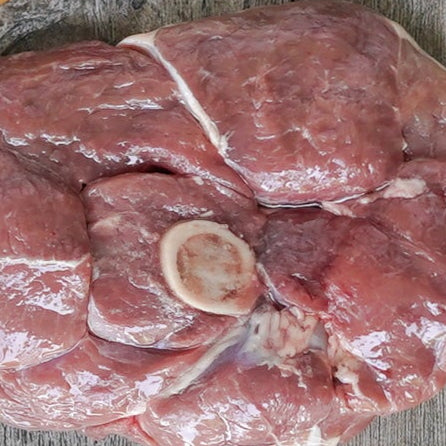 Raw lamb on a wooden surface